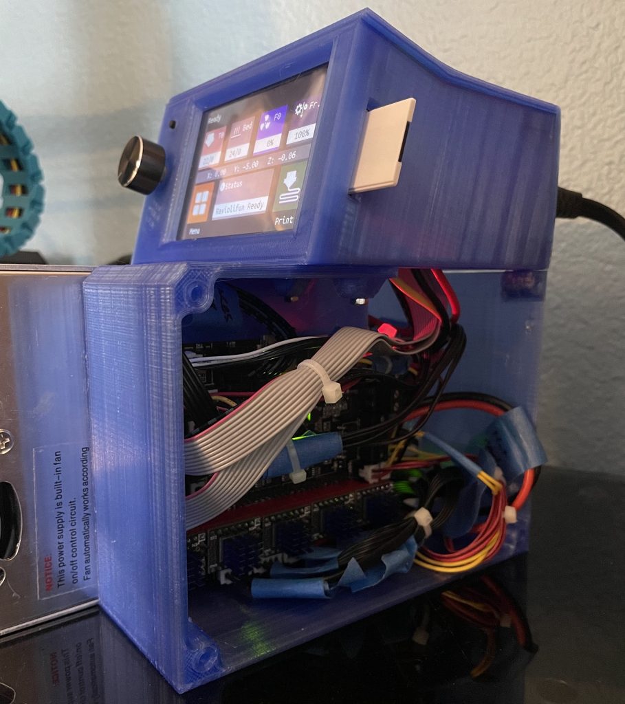 3D printer case open with electrics showing