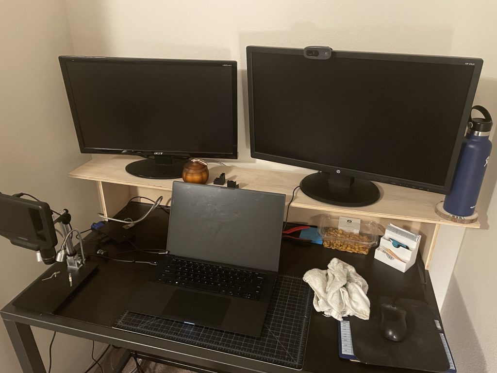 Desk shelf with my monitors on it and a storage compartment underneath